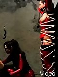 Latex dommes keep fem slave in bondage